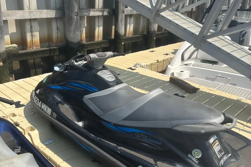 Slide: The Image of 2014 Yamaha WaveRunner VX Cruiser jet ski docked at marina. - 3