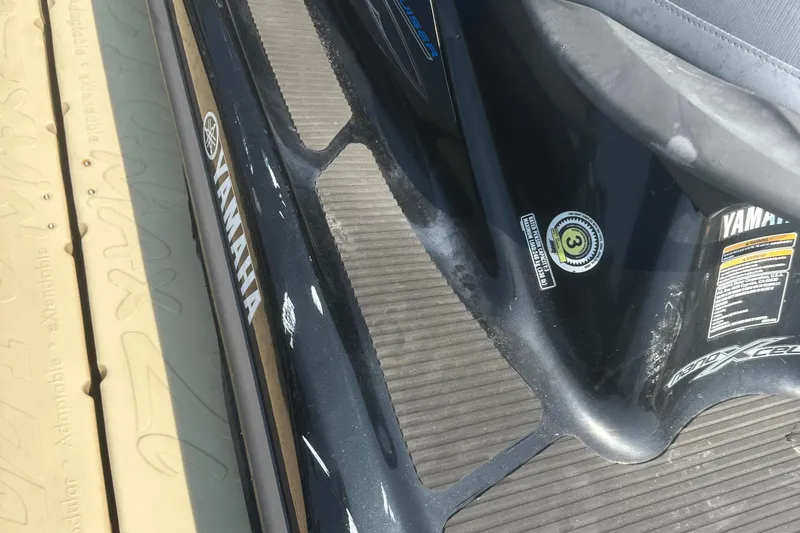 Slide: The Image of 2014 Yamaha WaveRunner VX Cruiser, black with visible branding and safety labels. - 5