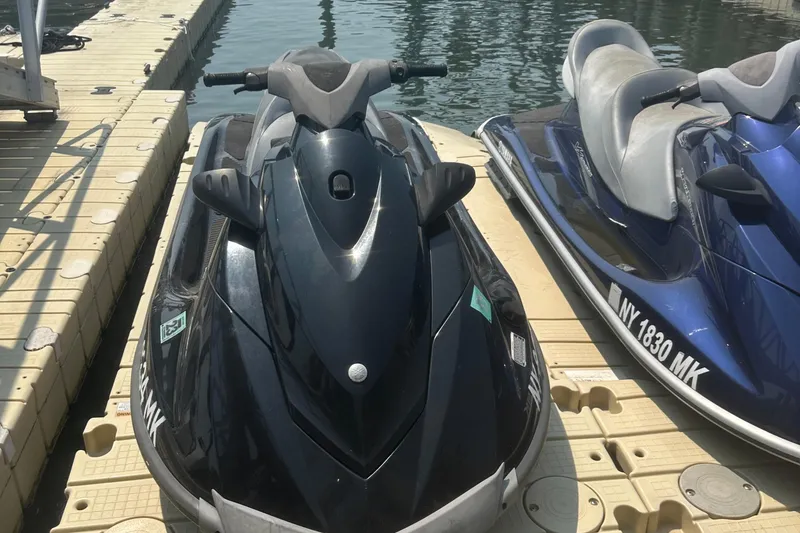 Slide: The Image of 2014 Yamaha WaveRunner VX Cruiser jet ski docked on a sunny day. - 7
