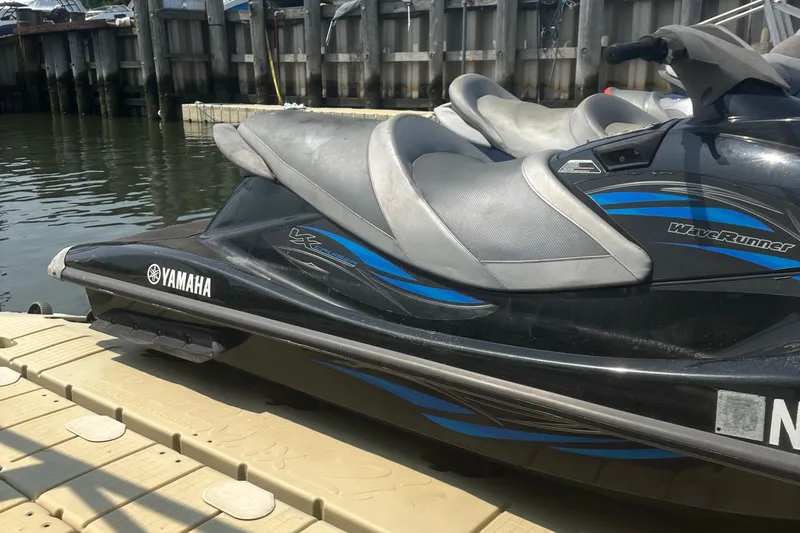 Slide: The Image of 2014 Yamaha WaveRunner VX Cruiser docked by the water. - 9