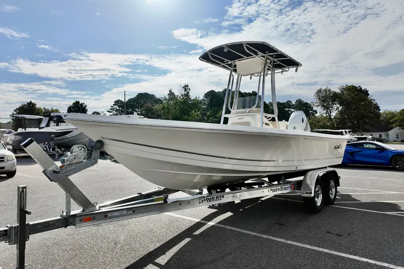Slide: The Image of 2026 Bulls Bay 2200 boat on trailer in parking lot under sunny sky. - 4