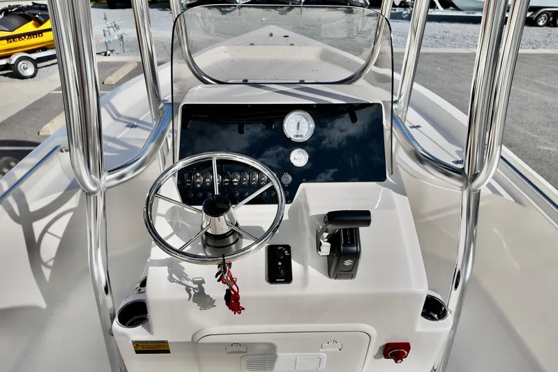 Slide: The Image of 2026 Bulls Bay 2200 boat console with steering wheel and controls. - 8