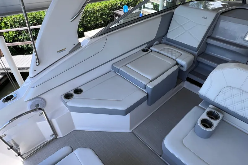 Slide: The Image of Luxurious interior of 2024 Regal 26 XO boat with plush seating and cup holders. - 19