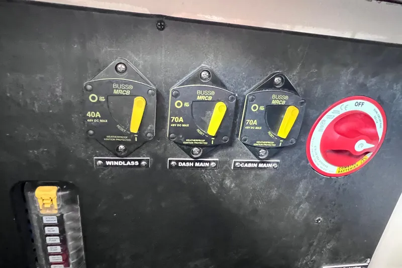 Slide: The Image of Electrical panel of 2024 Regal 26 XO boat with circuit breakers and battery switch. - 27