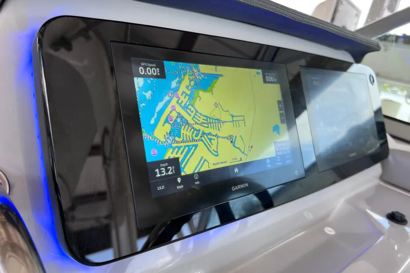 Slide: The Image of Garmin navigation display on 2024 Regal 26 XO boat dashboard. - 34