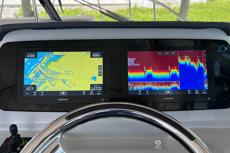 Slide: The Image of Garmin navigation displays on 2024 Regal 26 XO boat dashboard. - 36