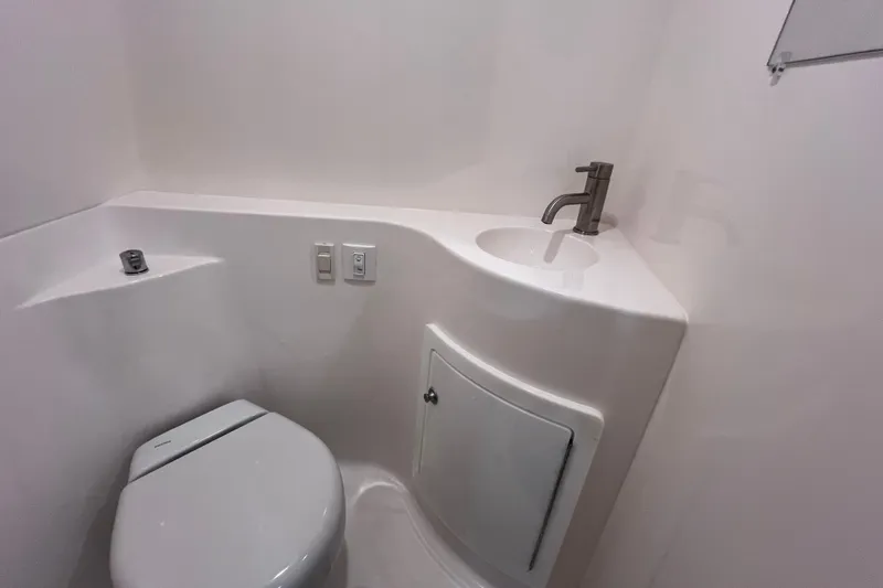 Slide: The Image of 2024 Regal 26 XO boat bathroom with modern sink and toilet. - 64