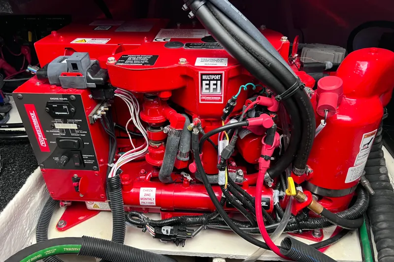 Slide: The Image of 2024 Regal 26 XO engine compartment with red multiport EFI system and wiring. - 66