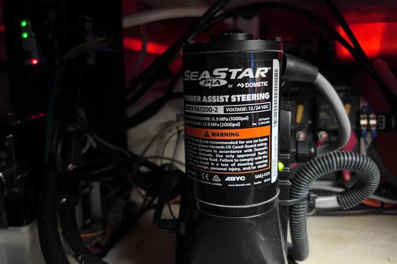 Slide: The Image of SeaStar power assist steering system in 2024 Regal 26 XO boat. - 68