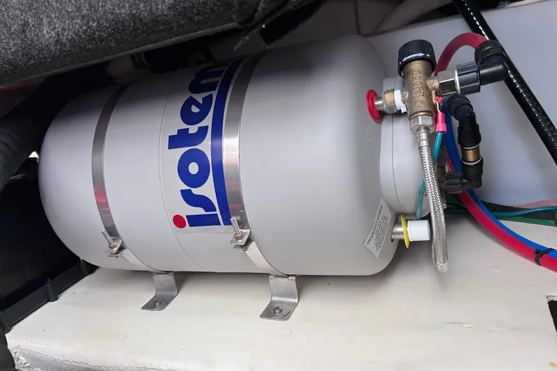 Slide: The Image of Isotemp water heater in 2024 Regal 26 XO boat engine compartment. - 69