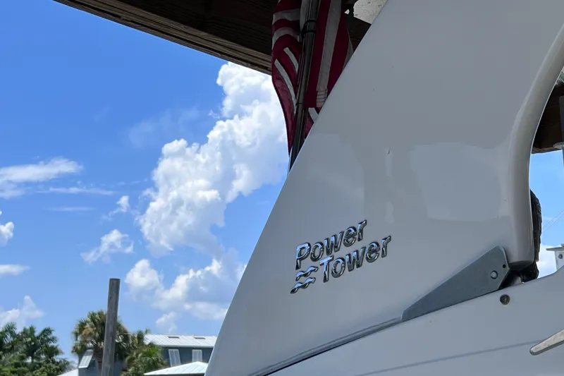 Slide: The Image of 2024 Regal 26 XO Power Tower against a clear blue sky. - 9