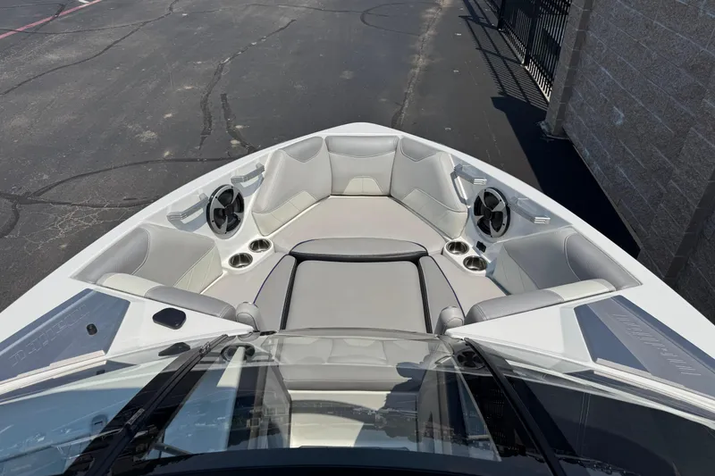 Slide: The Image of 2018 Malibu Wakesetter 23 LSV boat interior with sleek seating and cup holders. - 10