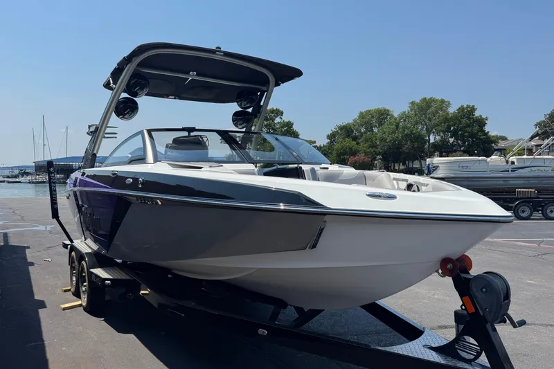 Slide: The Image of 2018 Malibu Wakesetter 23 LSV boat on trailer at marina. - 4