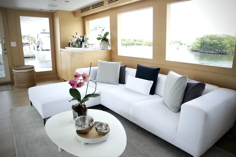 Slide: The Image of Luxurious interior of 2002 Hatteras 92 Cockpit Motor Yacht with elegant seating and decor. - 11