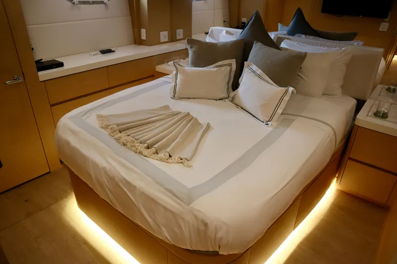 Slide: The Image of Luxurious bedroom interior of 2002 Hatteras 92 Cockpit Motor Yacht with elegant bedding. - 19