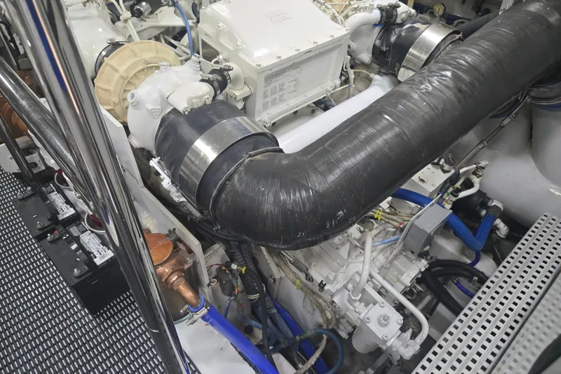 Slide: The Image of Engine room of 2002 Hatteras 92 Cockpit Motor Yacht with visible components and wiring. - 40