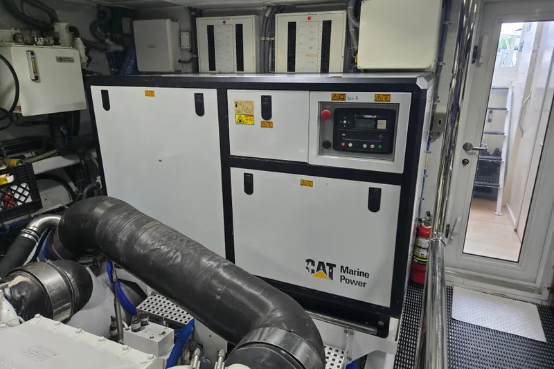 Slide: The Image of Engine room of 2002 Hatteras 92 Cockpit Motor Yacht with CAT Marine Power generator. - 47