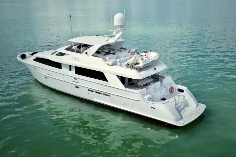 Slide: The Image of Luxurious 2002 Hatteras 92 Cockpit Motor Yacht on calm waters. - 6