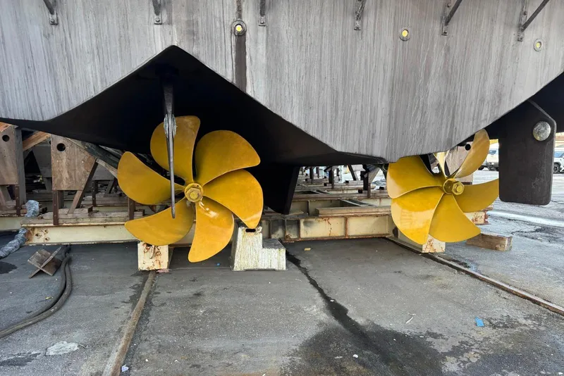 Slide: The Image of Propellers of 2002 Hatteras 92 Cockpit Motor Yacht on dry dock. - 60