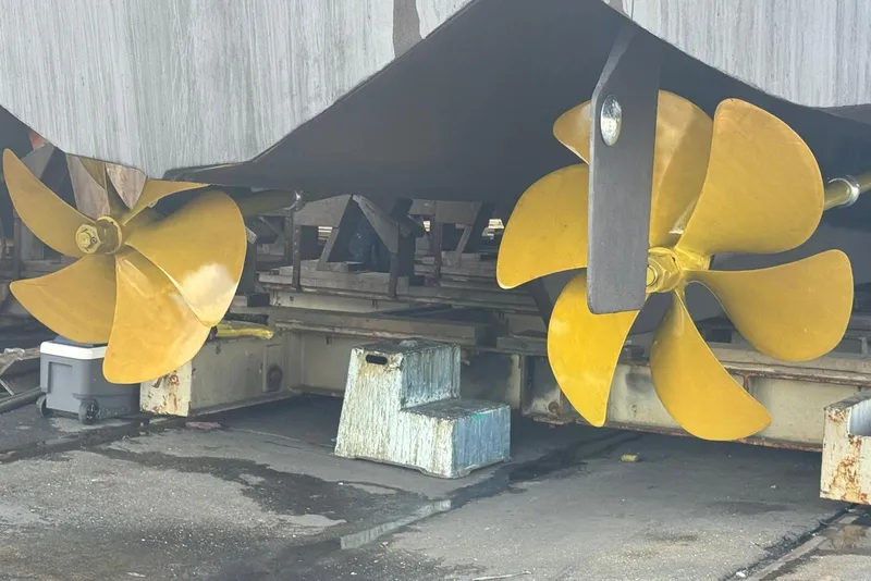 Slide: The Image of Propellers of a 2002 Hatteras 92 Cockpit Motor Yacht on dry dock. - 61
