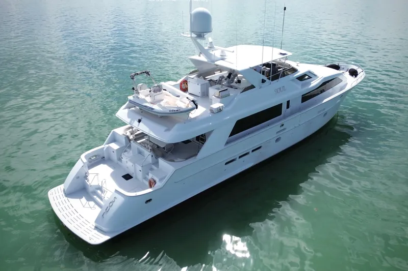 Slide: The Image of Luxurious 2002 Hatteras 92 Cockpit Motor Yacht on serene water. - 8