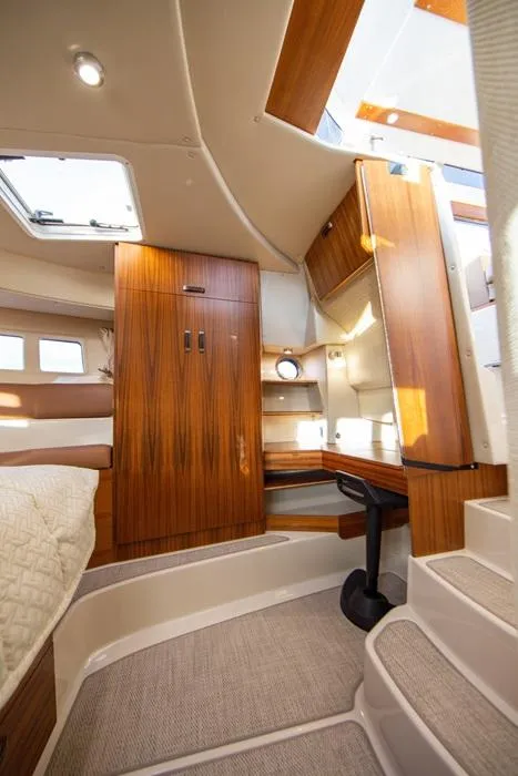 Slide: The Image of Interior of 2025 Ranger Tugs 43 Command Bridge, featuring wood accents and modern design. - 30