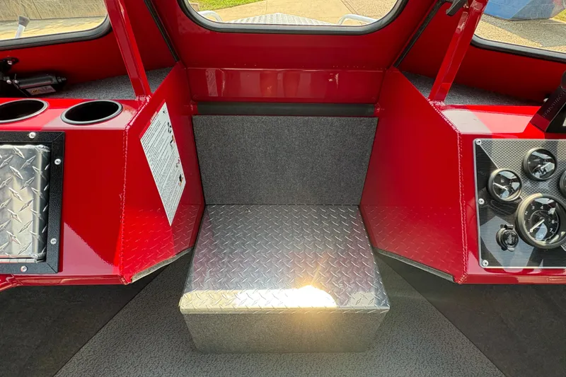 Slide: The Image of Interior of 2026 Lund 185 HG boat with red accents and control panel. - 14