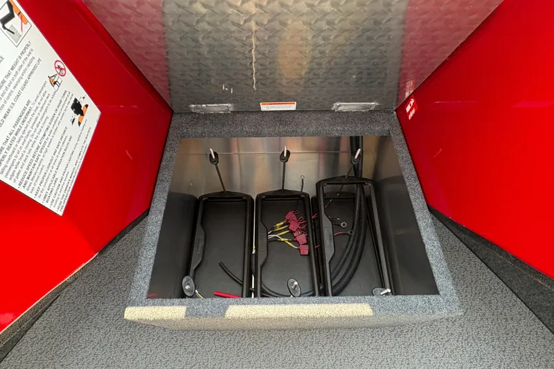 Slide: The Image of Storage compartment in 2026 Lund 185 HG boat with red interior panels. - 15