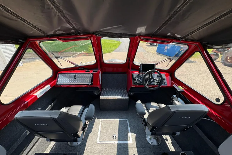 Slide: The Image of Interior of 2026 Lund 185 HG boat with dual seats and modern dashboard. - 16