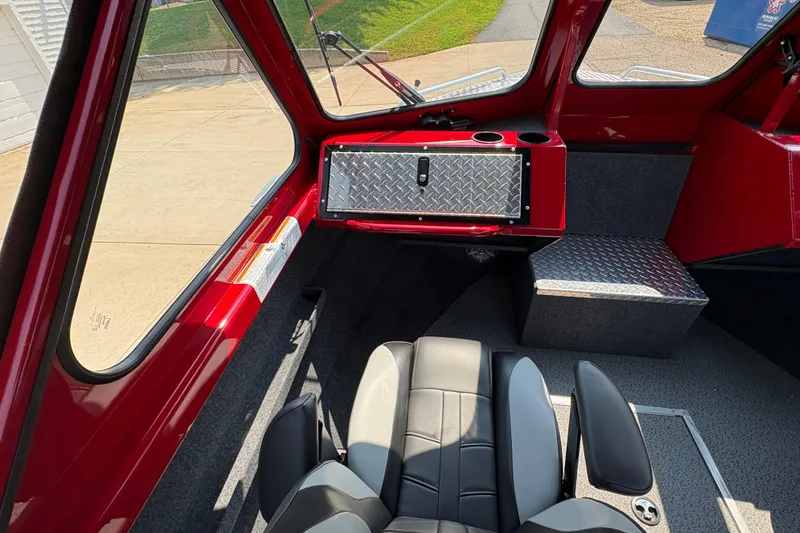 Slide: The Image of Interior of 2026 Lund 185 HG boat with red accents and modern seating. - 19