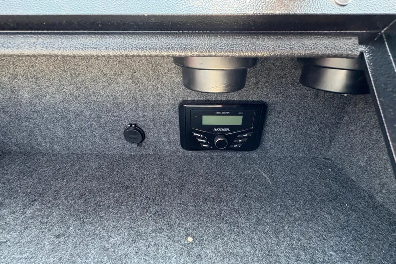 Slide: The Image of 2026 Lund 185 HG boat interior with Kicker media center and speakers. - 21