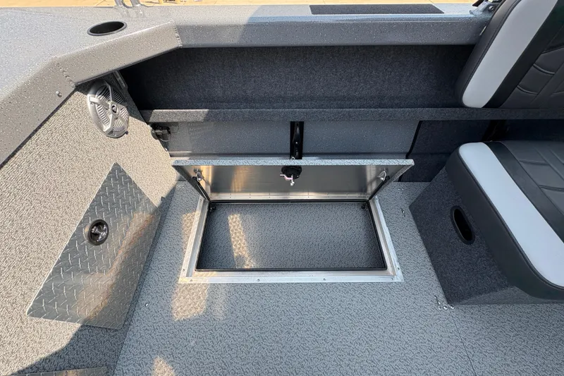 Slide: The Image of 2026 Lund 185 HG boat interior with open storage compartment and seating. - 26