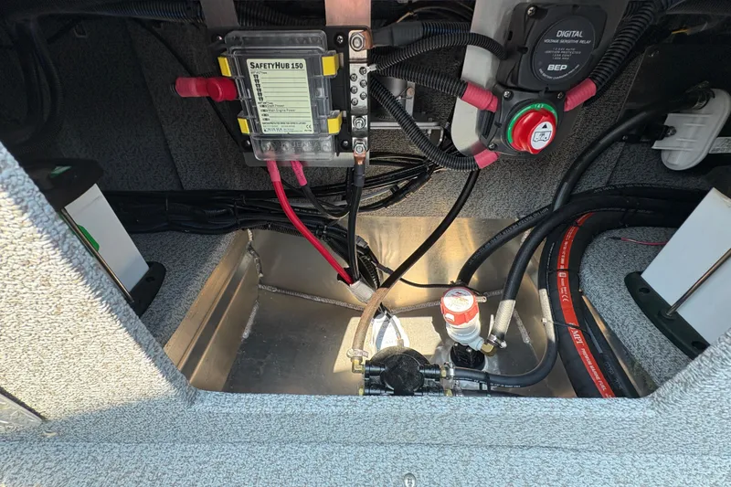 Slide: The Image of Interior view of 2026 Lund 185 HG boat wiring and components. - 29