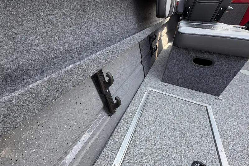 Slide: The Image of 2026 Lund 185 HG boat interior with gray carpet and seating. - 37