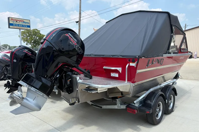 Slide: The Image of 2026 Lund 185 HG boat with Mercury Pro XS engine, parked on a trailer. - 40