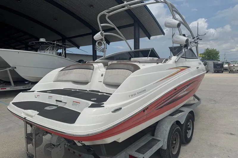 Slide: The Image of 2007 Yamaha AR 230 boat on trailer, featuring twin engines and sleek design. - 6