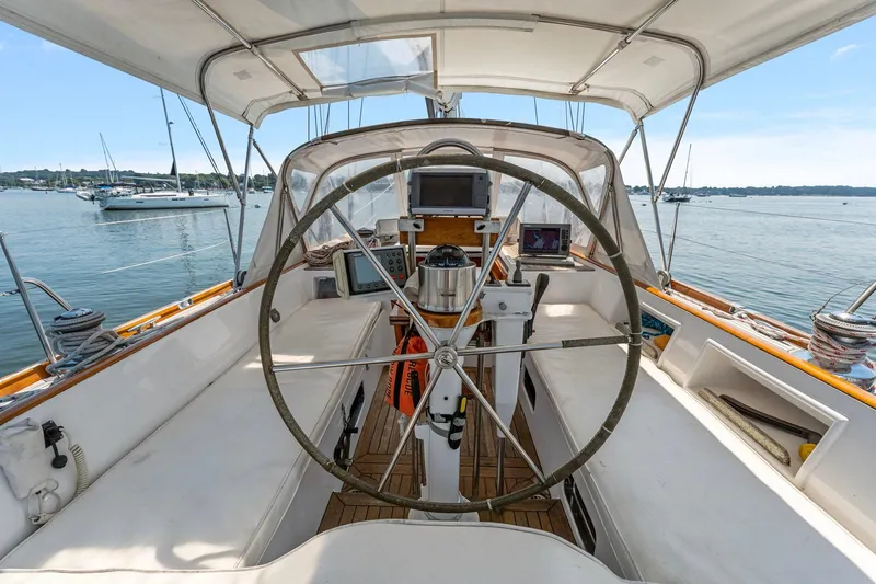 Slide: The Image of Cockpit of 1996 Tayana 58 sailboat with steering wheel and navigation equipment. - 17