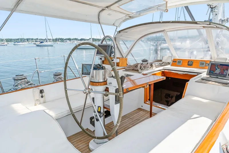 Slide: The Image of Cockpit of 1996 Tayana 58 sailboat with steering wheel and navigation equipment. - 18
