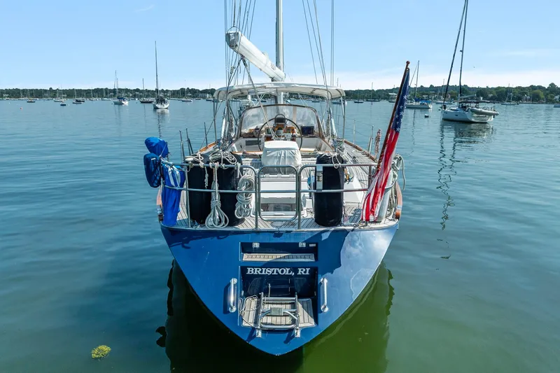 Slide: The Image of Sailing yacht Tayana 58, 1996 model, anchored in calm waters with other boats. - 3