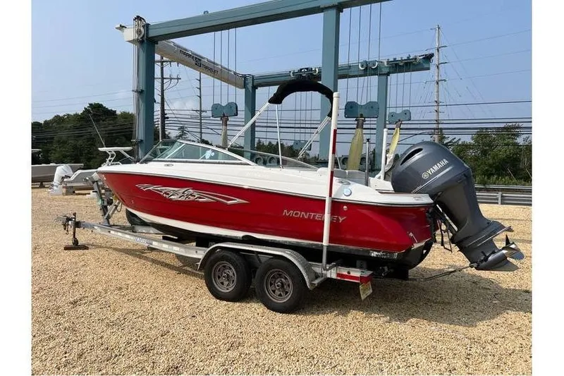 Slide: The Image of 2015 Monterey 217 Blackfin boat on trailer with Yamaha outboard motor. - 0