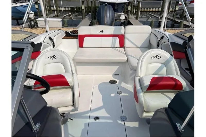 Slide: The Image of 2015 Monterey 217 Blackfin boat interior with white and red seating. - 13