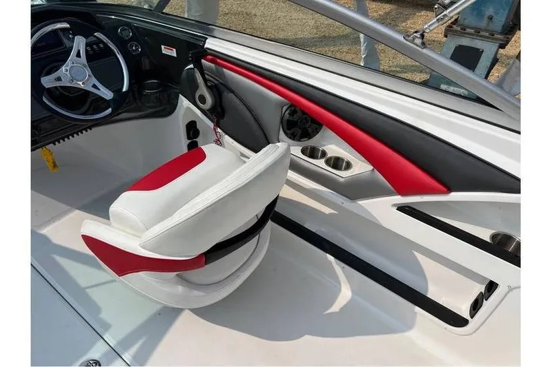Slide: The Image of Interior of 2015 Monterey 217 Blackfin boat with red and white seating. - 16