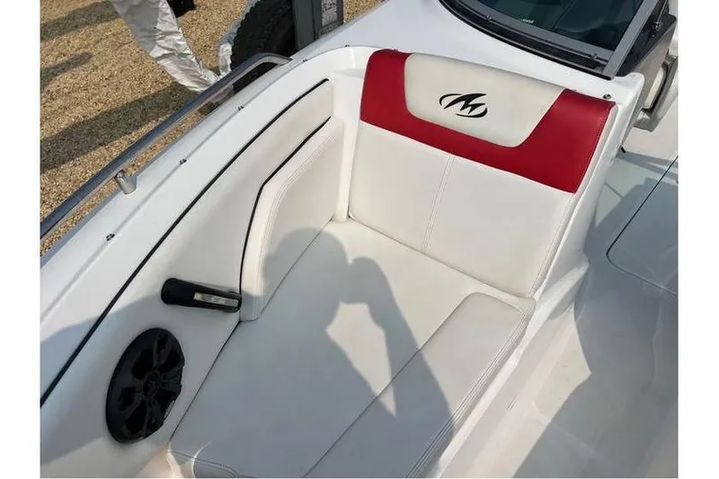Slide: The Image of White and red seating on 2015 Monterey 217 Blackfin boat, featuring logo and speaker. - 19