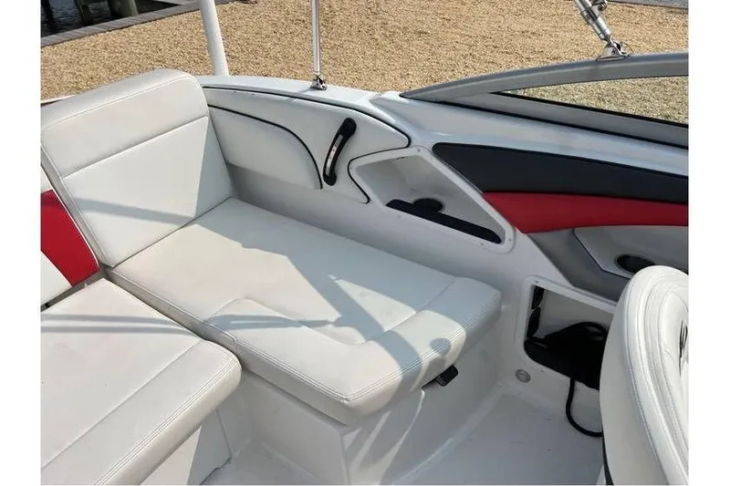 Slide: The Image of Interior of 2015 Monterey 217 Blackfin boat with white seating and red accents. - 21