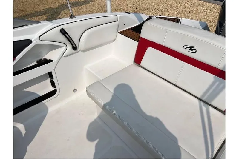 Slide: The Image of 2015 Monterey 217 Blackfin boat interior with white and red seating. - 22