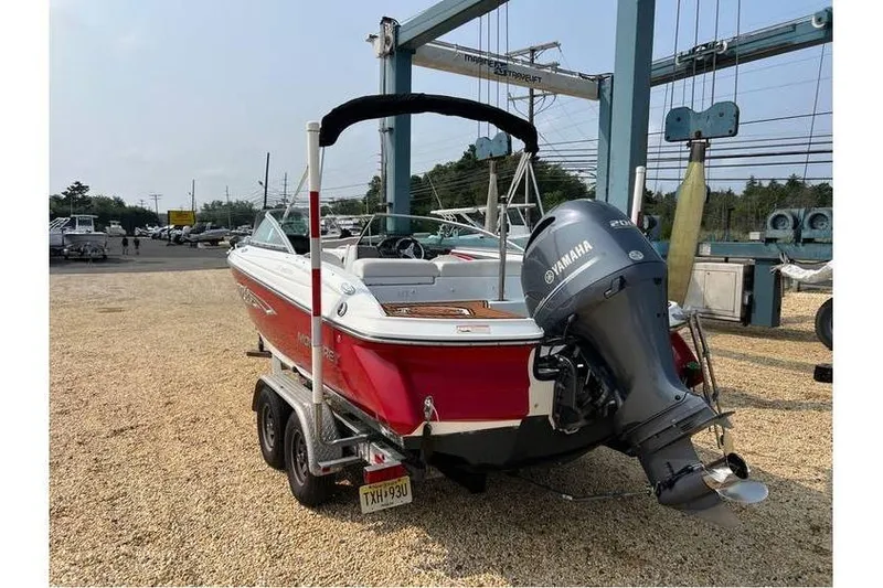 Slide: The Image of 2015 Monterey 217 Blackfin boat with Yamaha engine on trailer in marina. - 4