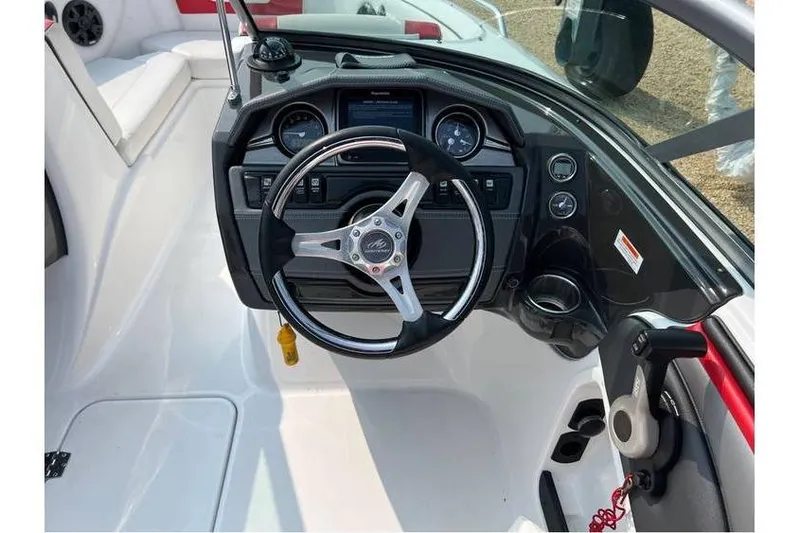 Slide: The Image of Steering console of 2015 Monterey 217 Blackfin boat with modern controls and gauges. - 7
