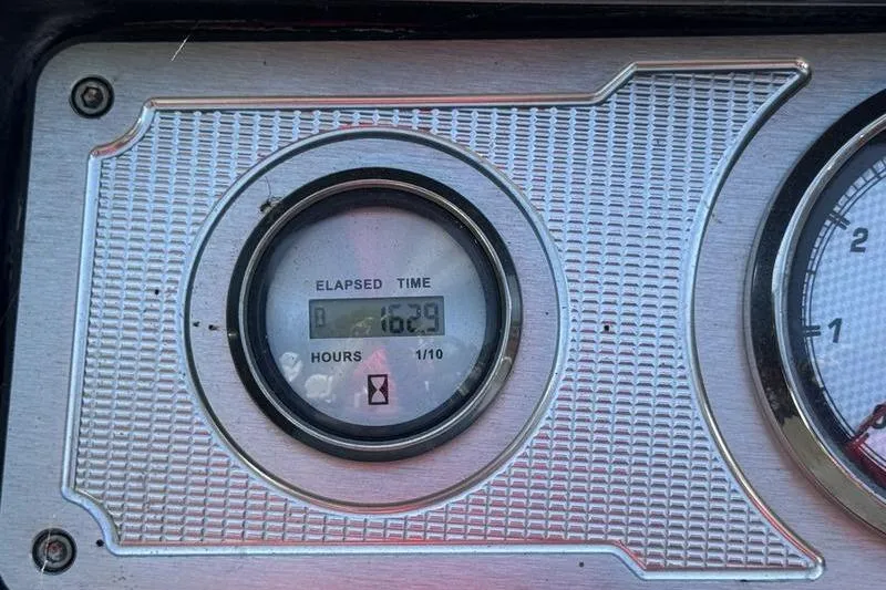 Slide: The Image of Elapsed time gauge on 2020 Crest Caribbean LX 250 SLC, showing 162.9 hours. - 14