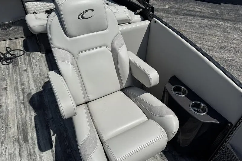 Slide: The Image of Luxurious seating on 2020 Crest Caribbean LX 250 SLC boat with cup holders. - 7