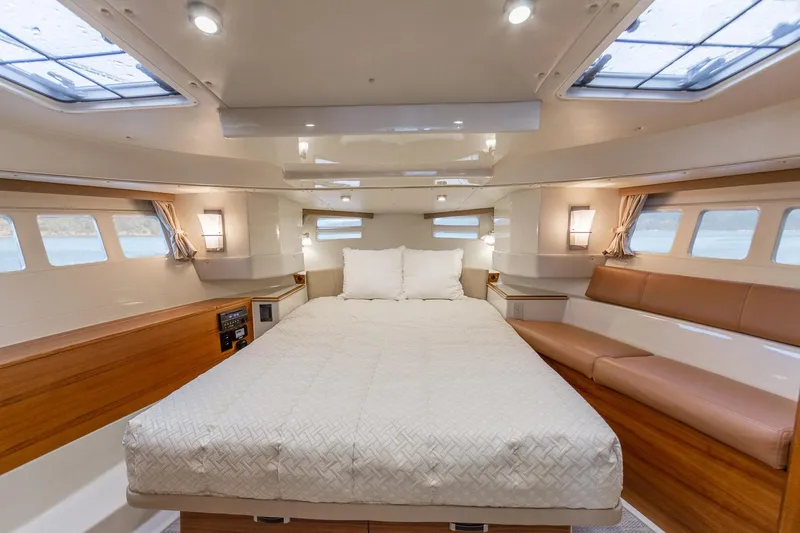 Slide: The Image of Luxurious cabin interior of 2025 Ranger Tugs R-43 S with spacious bed and seating. - 10